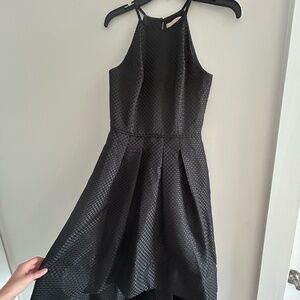 Black dress. Short in the front and "long" in the back